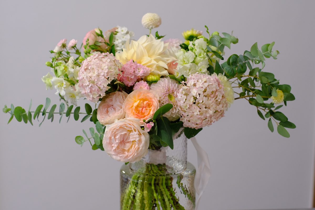 A bouquet of peonies, roses and eucalyptus
